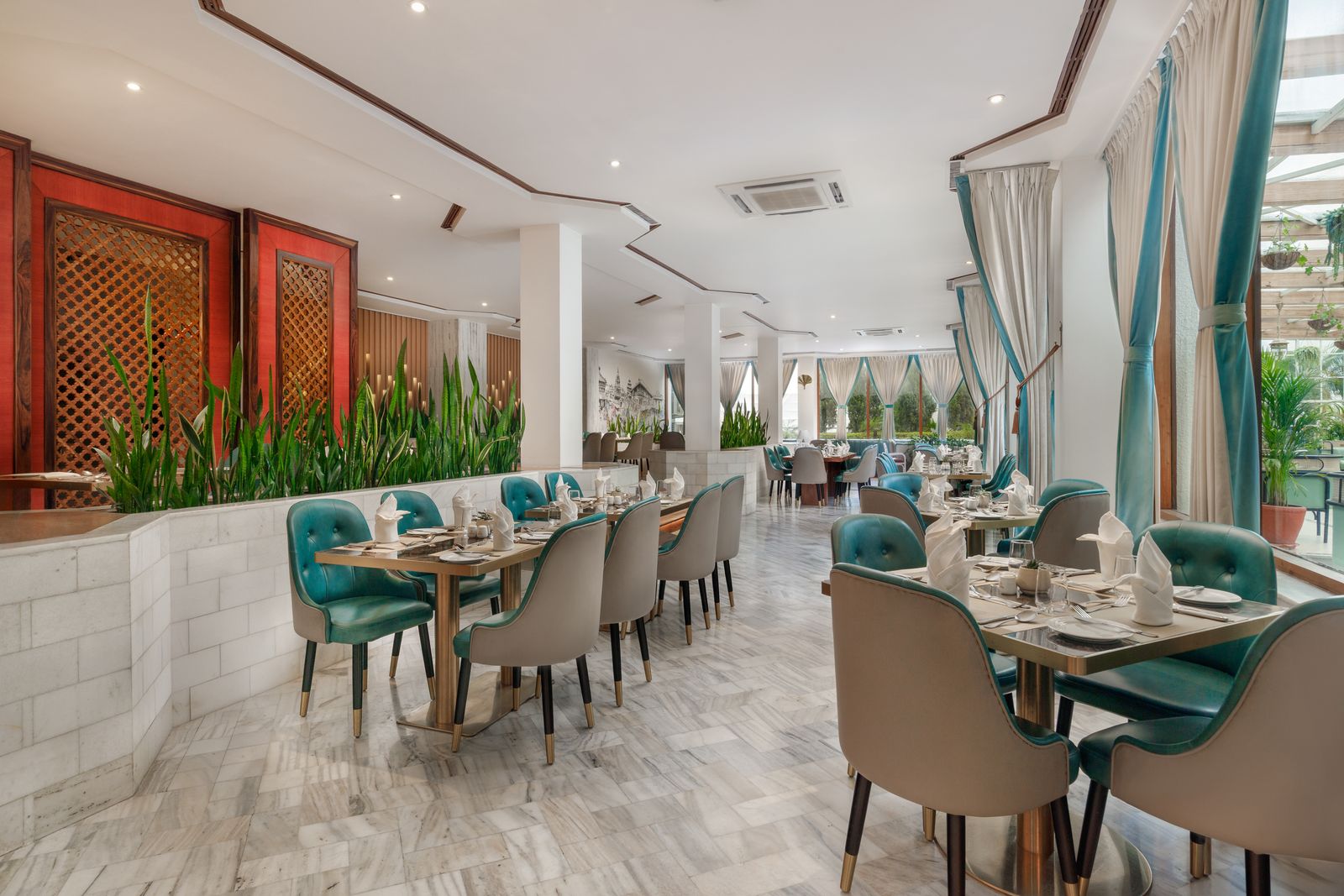 Café Horizon restaurant interior with bright seating and garden views